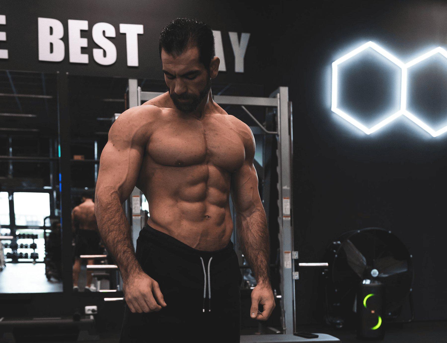 Abdullah standing under the lights of his gym